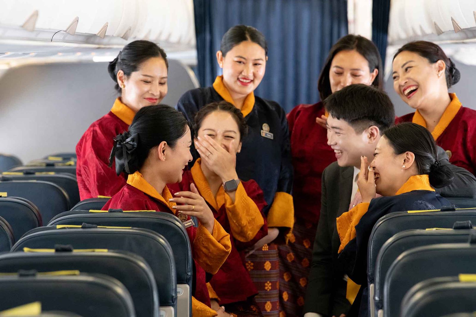 Bhutan Airlines cabin crew welcoming guests