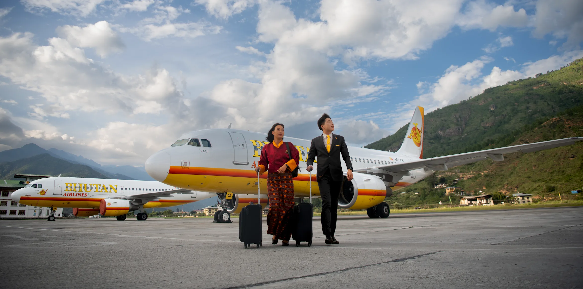 Bhutan Airlines crew walking beside aircraft at Paro International Airport